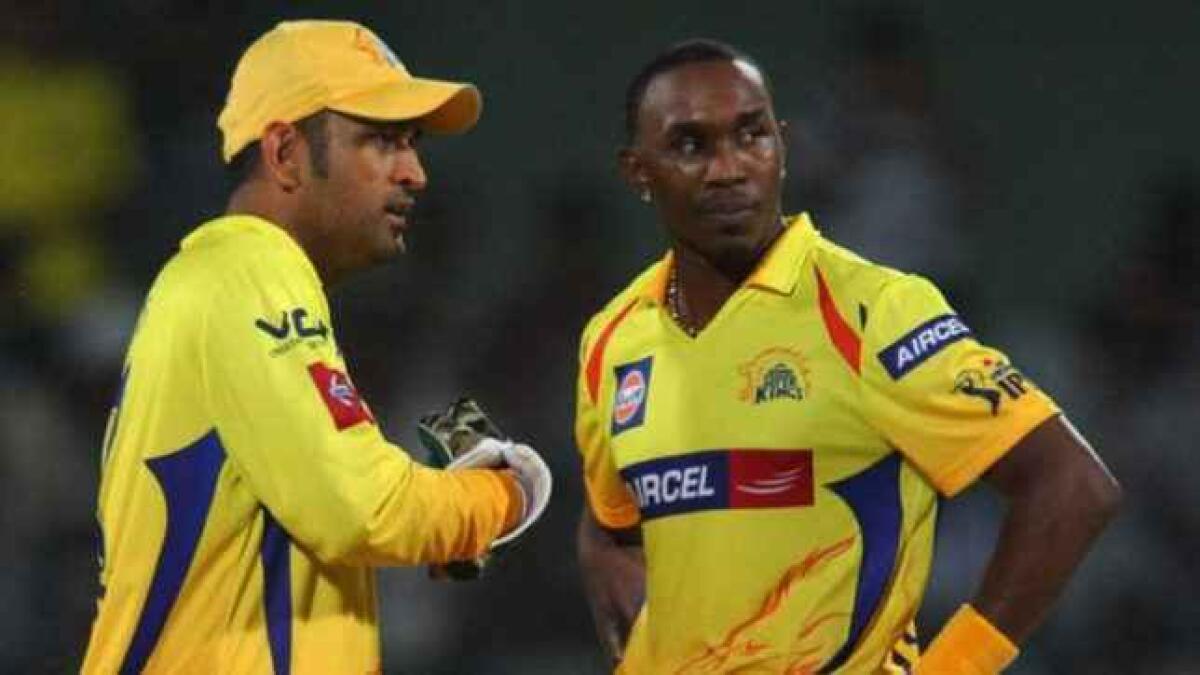 BROTHERS FROM ANOTHER MOTHER: MS Dhoni (left) and Dwayne Bravo. - Agencies