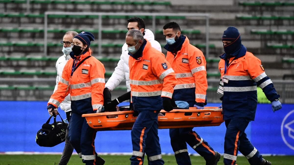 Paris Saint-Germain's Neymar is stretchered off during the game. — AFP