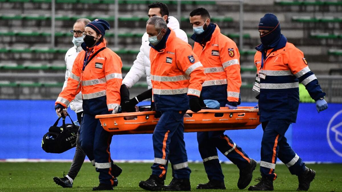 Paris Saint-Germain's Neymar is stretchered off during the game. — AFP