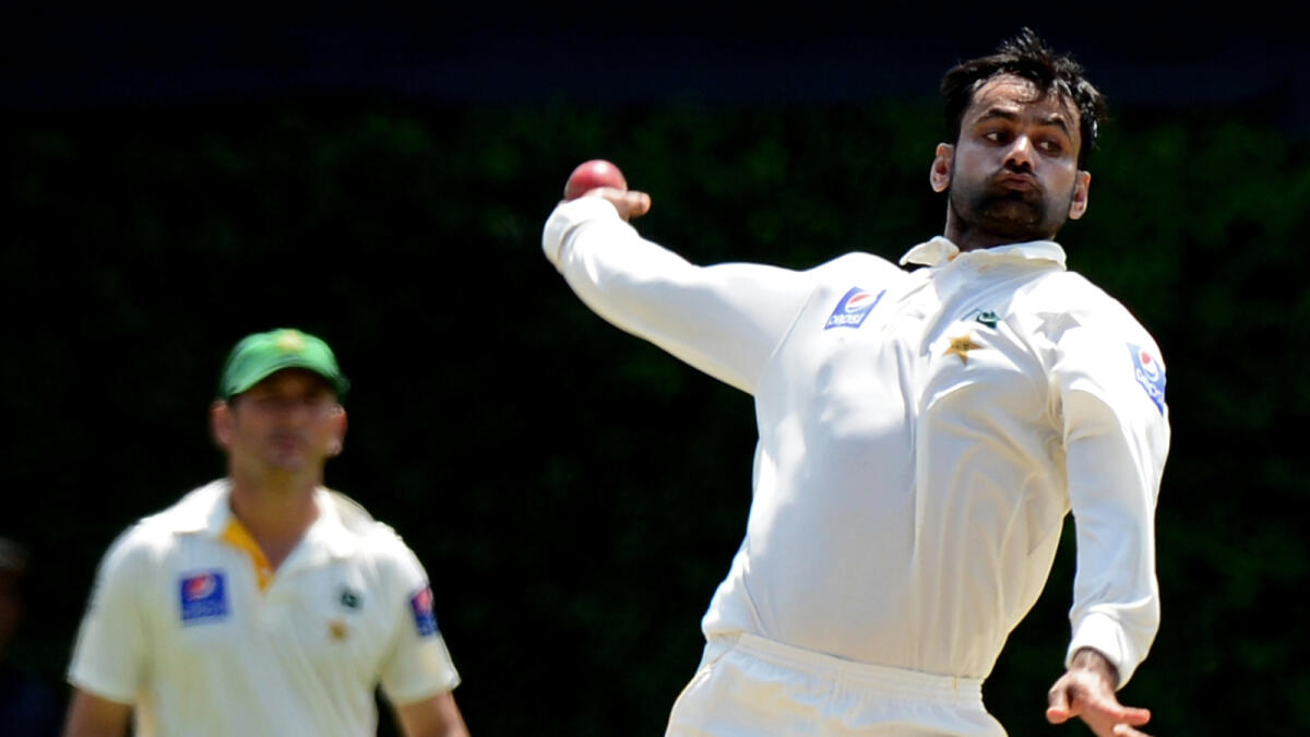 Hafeez banned from bowling for 12 months