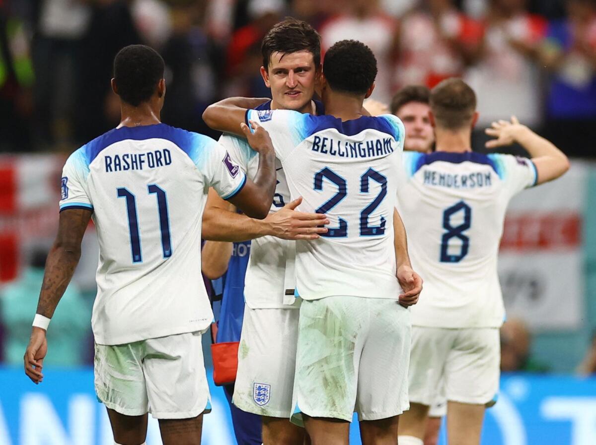 England's Harry Maguire, Jude Bellingham and Marcus Rashford celebrate qualifying for the quarter finals. Photo: Reuters