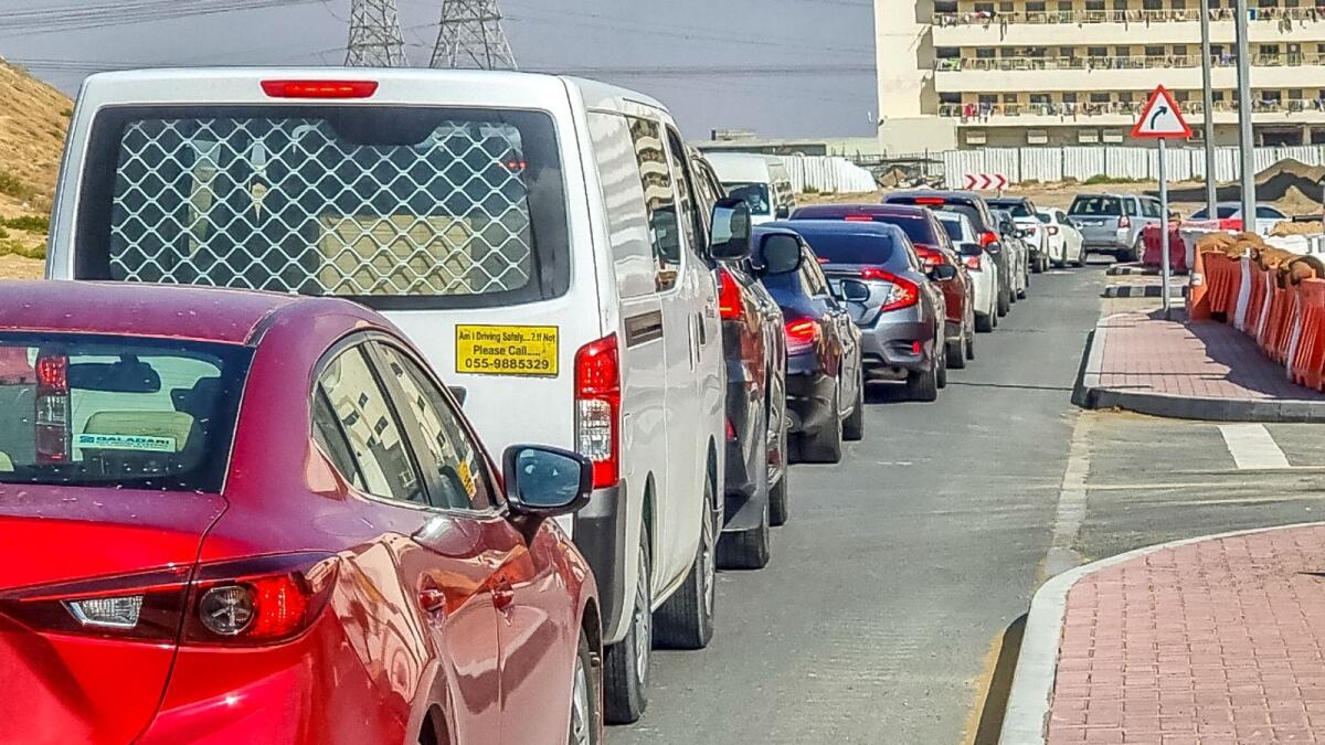 Long queue of vehicles for the drive-through PCR test centre in Al Khawaneej on Tuesday morning. January 4, 2022. Photo: Shihab