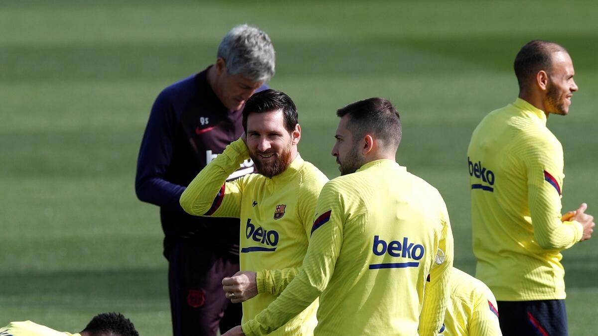 Barcelona's Lionel Messi and teammates during a training session