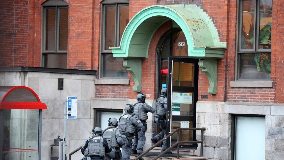 Police enter the offices of gaming software developer Ubisoft during a police security operation in Montreal, Quebec, Canada November 13, 2020.