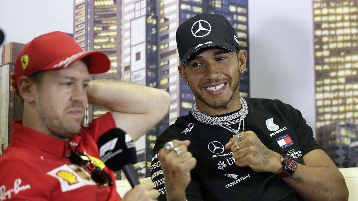 ALL SET: Lewis Hamilton (right) pretends to box with Sebastian Vettel during a press conference in Melbourne.