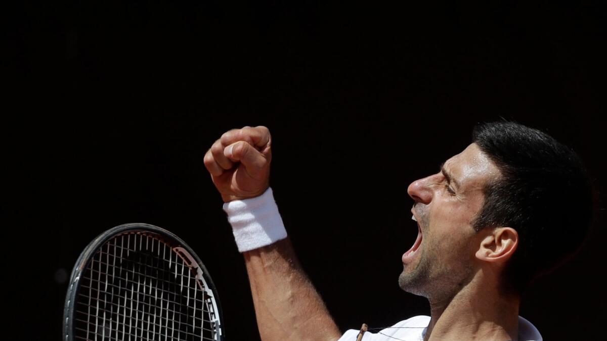 Serbia's Novak Djokovic celebrates after winning a point to Greece's Stefanos Tsitsipas during their quarterfinal at the Italian Open. — AP