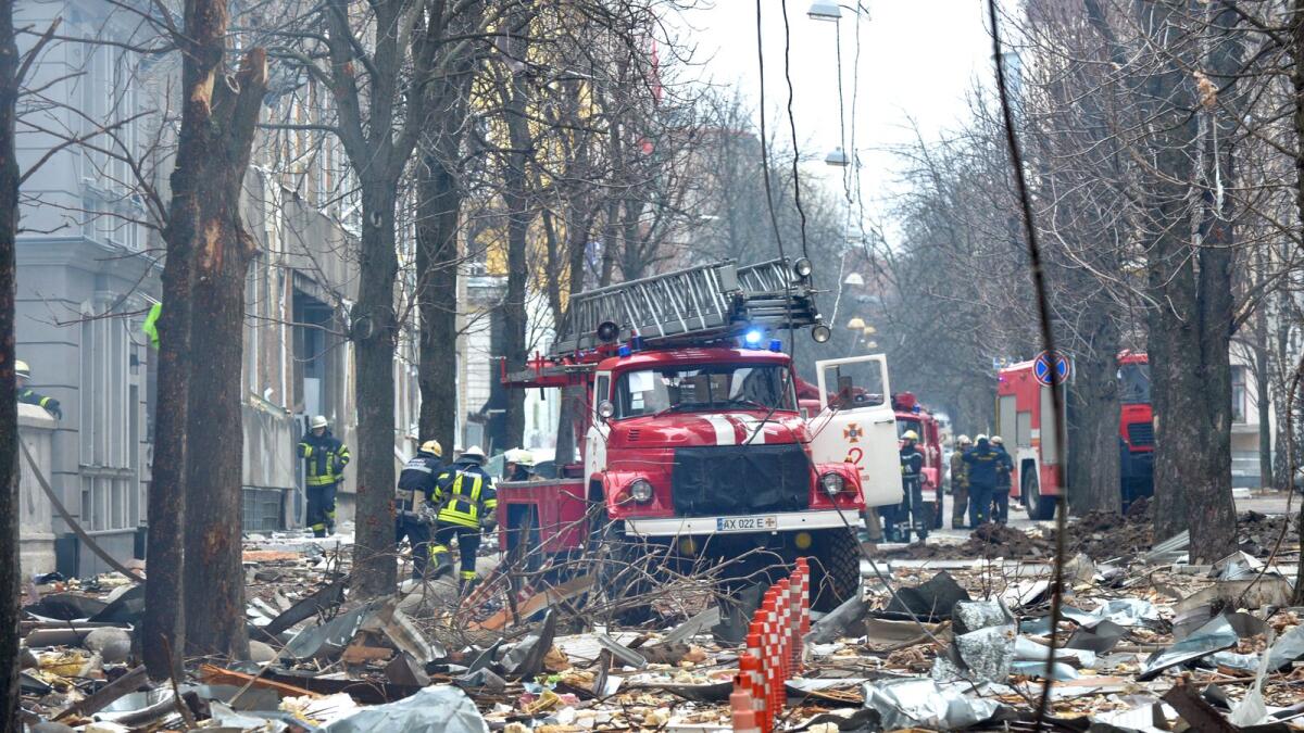 Firefighters work to contain a fire in the complex of buildings housing the Kharkiv regional SBU security service and the regional police, allegedly hit during recent shelling by Russia, in Kharkiv on March 2, 2022. Photo: AFP