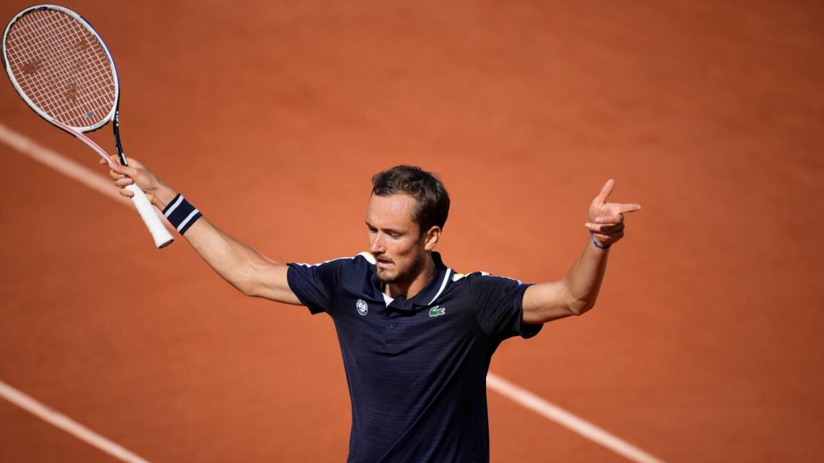 Russia's Daniil Medvedev celebrates after winning a point against Chile's Cristian Garin. — AP