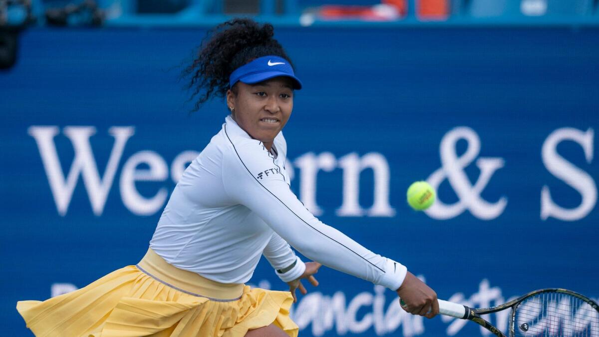 Naomi Osaka plays a return during her defeat on Tuesday. (Reuters)