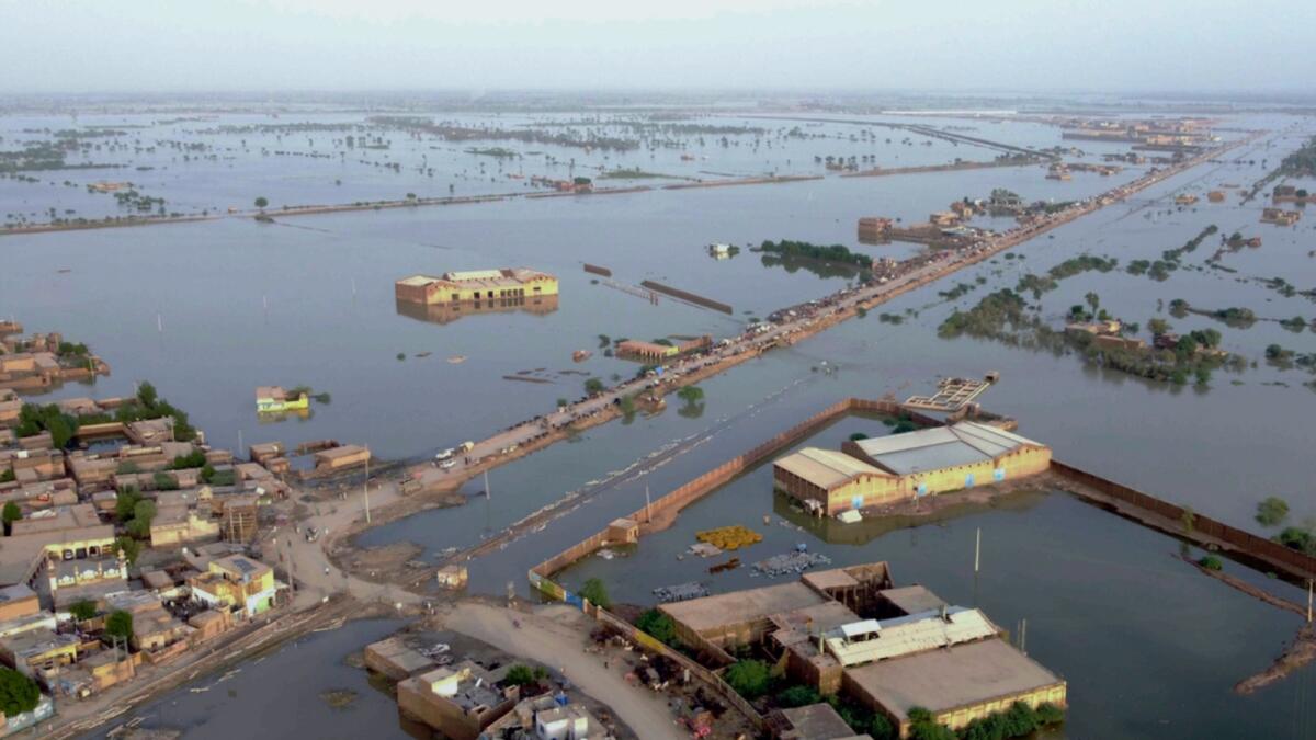 Homes are surrounded by floodwaters in Sohbat Pur city, a district of Pakistan's southwestern Baluchistan province. — AP