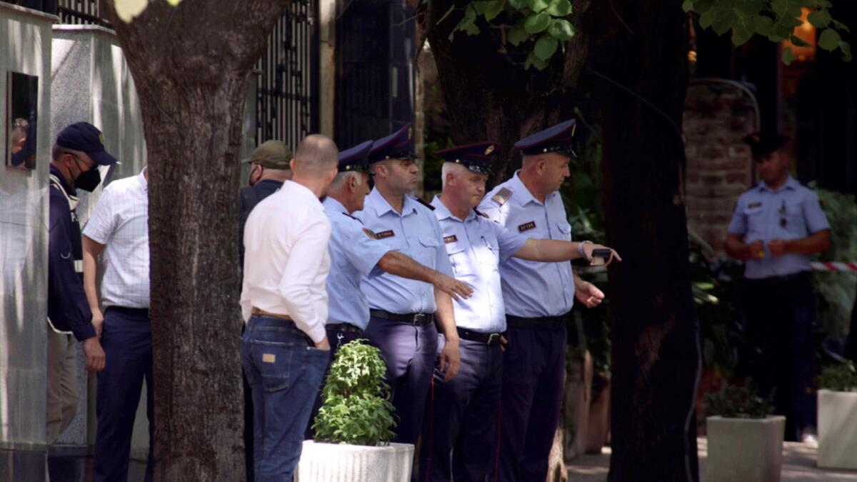 Police guard outside the Iranian Embassy in Tirana, Albania. The last staff of the embassy  left the building after they were given 24 hours to leave Albania over a major cyber attack. — AP