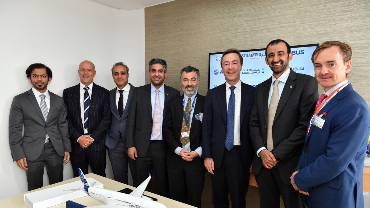 Officials of Mubadala and Airbus at the signing of a deal at the Farnborough airshow. 