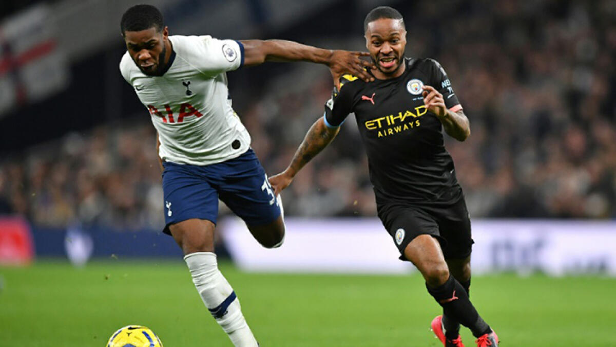 Manchester City's Raheem Sterling (right) has expressed concern over a quick return for the Premier League. -- AFP file