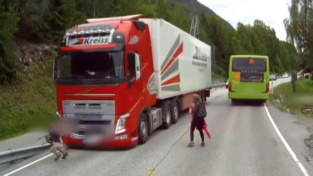 Video: Child saved by a whisker after alert truck driver slams brakes
