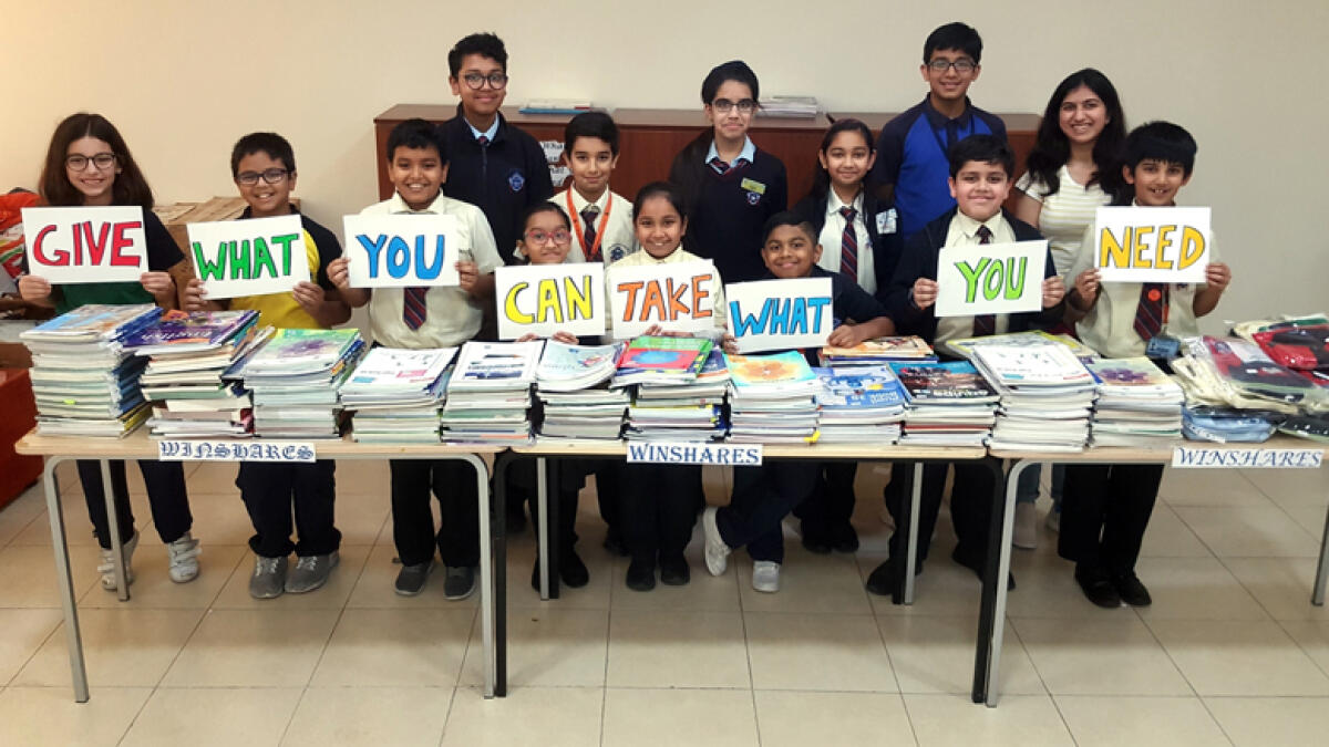 Students share old books, uniforms for schoolmates to use next year