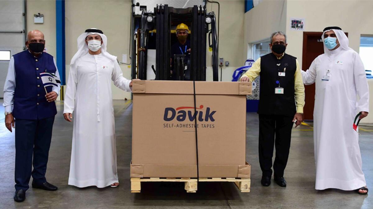 NEW BUSINESS: Senior officials from DP World receiving container carrying an export shipment from Israel. — Supplied photo