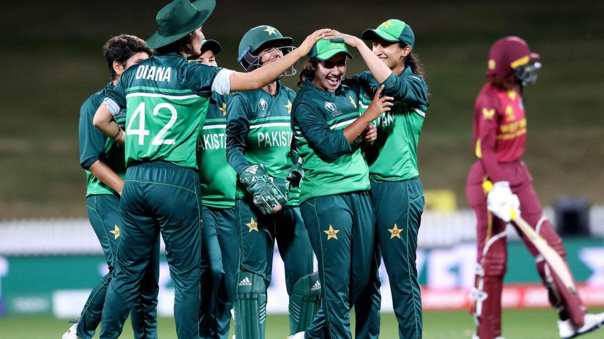 Pakistan players celebrate the wicket of West Indies' Stafanie Taylor (right) during the  World Cup match at Seddon Park in Hamilton. (AFP)