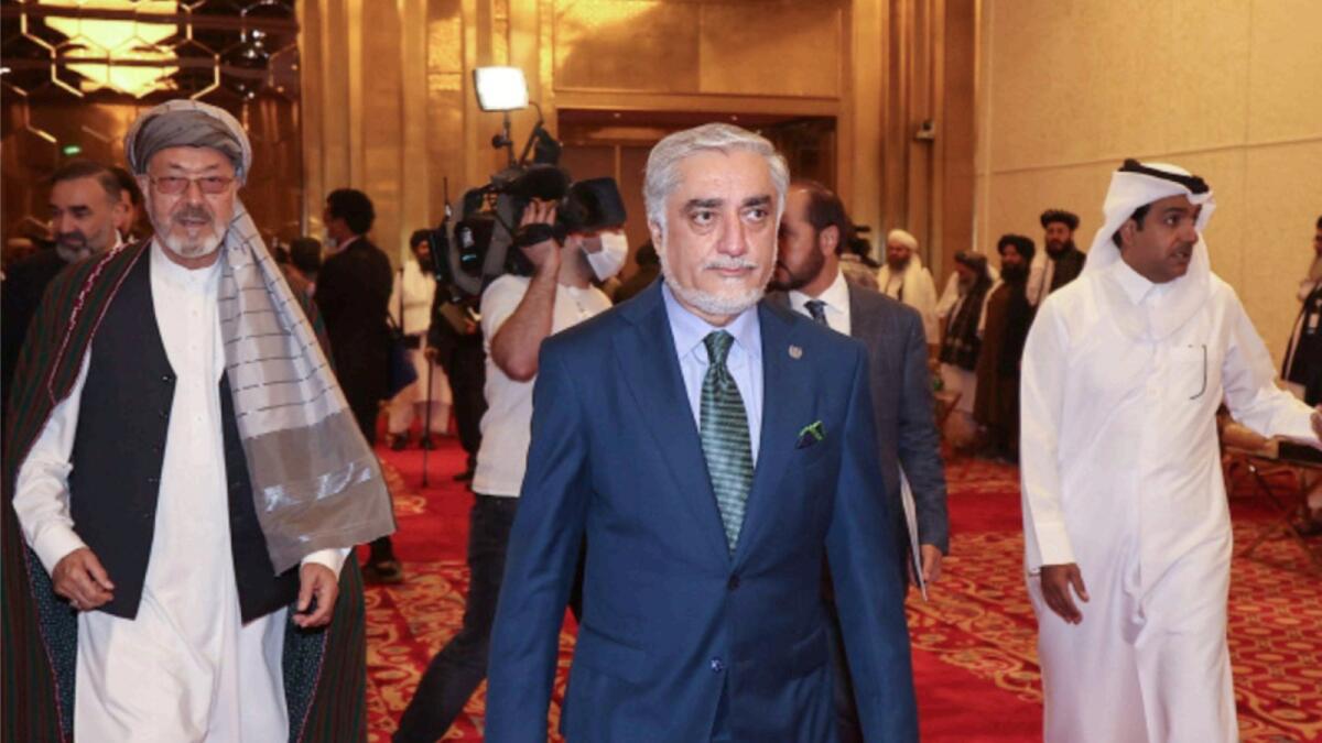 Afghanistan's former chief executive Abdullah Abdullah (C) attends a session of the peace talks between the Afghan government and the Taleban in Doha. — AFP