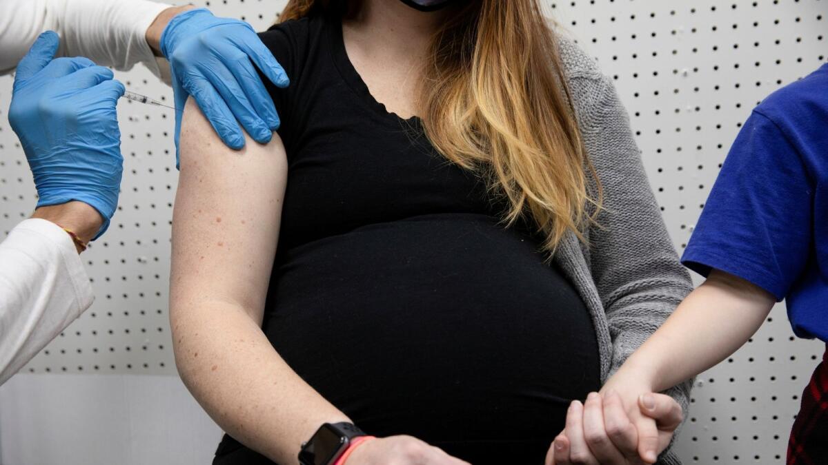 A pregnant woman receives a vaccine for Covid-19. — Reuters file