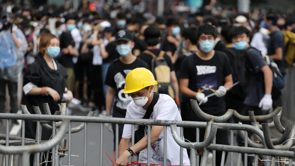 Thousands of Hong Kong protesters gather, govt offices shut after violent protests 