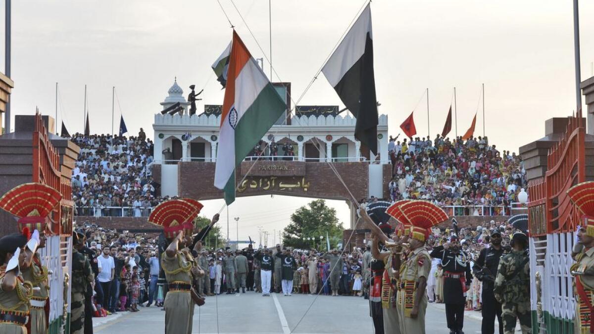 Indian and Pakistani flags are lowered during a daily retreat ceremony at the India-Pakistan joint border check. 