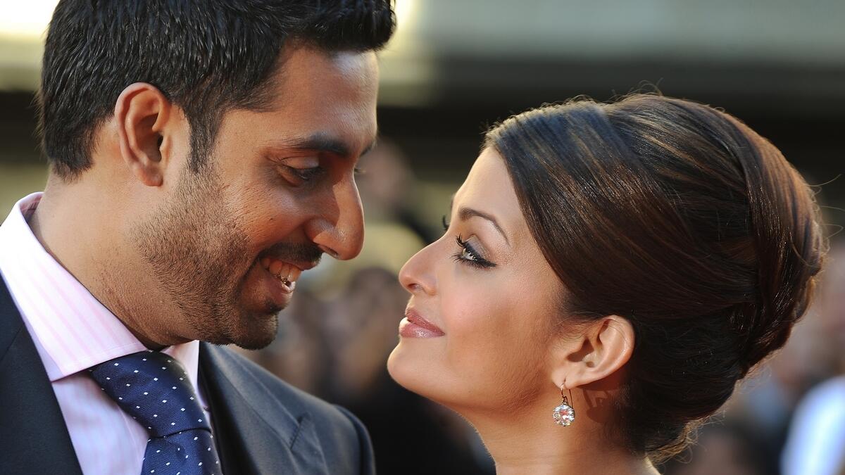 Indian actress Aishwarya Rai Bachchan (R) and husband Abhishek Bachchan.- AFP