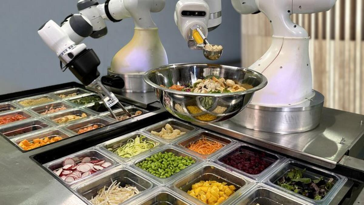 Dexai's 'Alfred' robot fits into existing restaurant kitchens and uses current brand recipes.