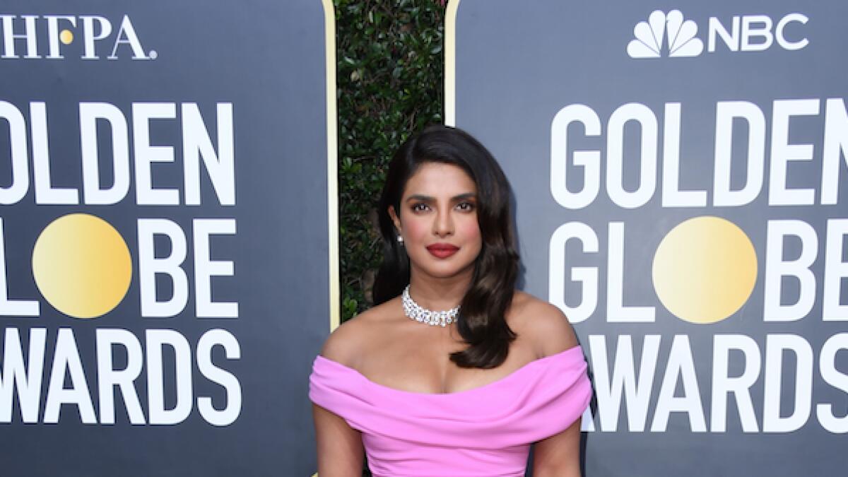 Priyanka Chopra opted for old school Hollywood glamour in a Cristina Ottaviano gown topped with Bulgari jewels