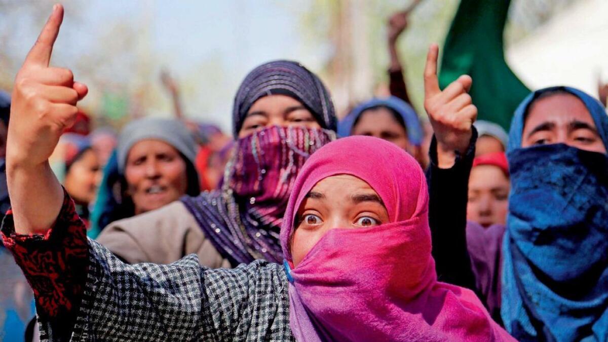 A woman shouts slogans during the funeral of Umer Farooq, a civilian, who was killed on Sunday at Baroosa village, near Srinagar. 
