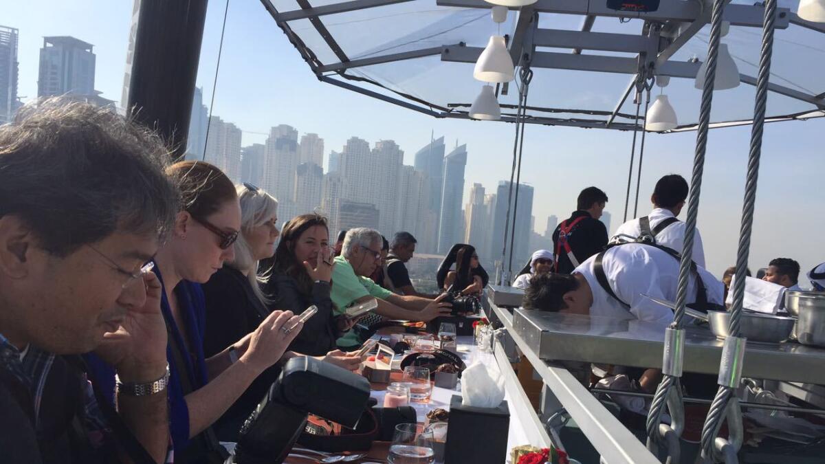 Popular dinner concept 'Dinner in the Sky' has come to Dubai International Marine Club. Never complain about 'ambience' ever again. Photo by Dhes Handumon