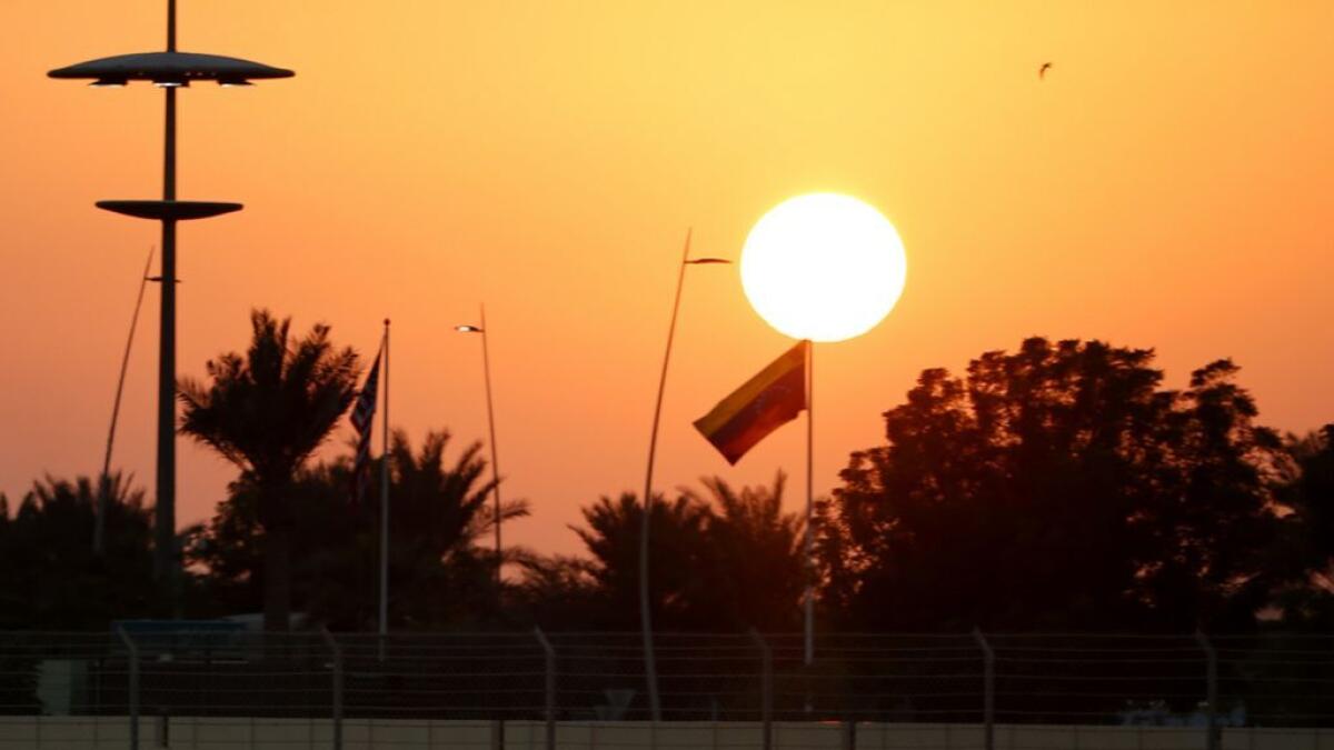 Rosberg and Hamilton under the Abu Dhabi twilight