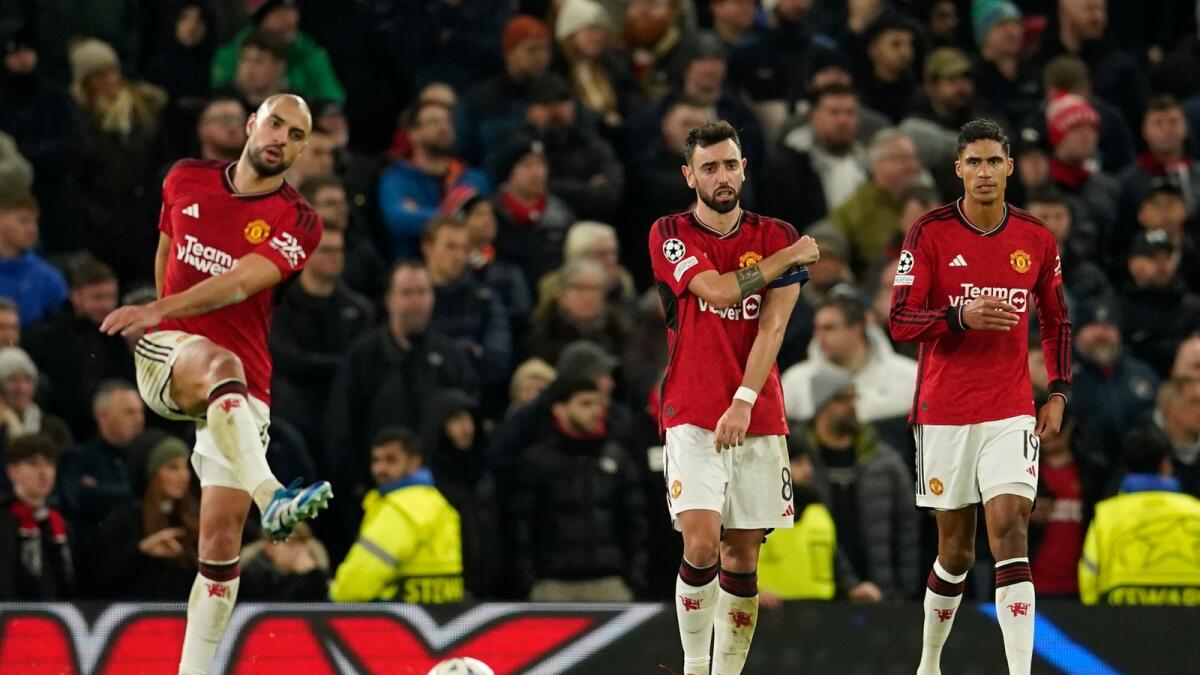Manchester United players are dejected after Bayern's Kingsley Coman scored his side's opening goal during the group A Champions League match at the Old Trafford stadium in Manchester, England, on Tuesday,. - AP