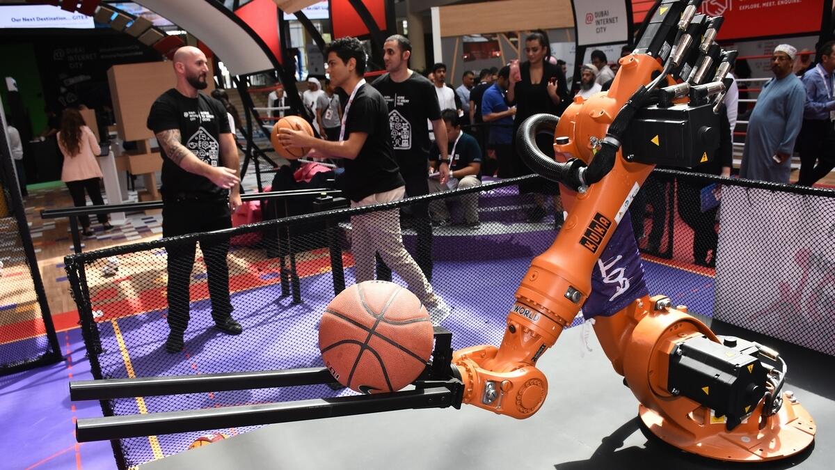 Robots, players shoot hoops side by side at Gitex