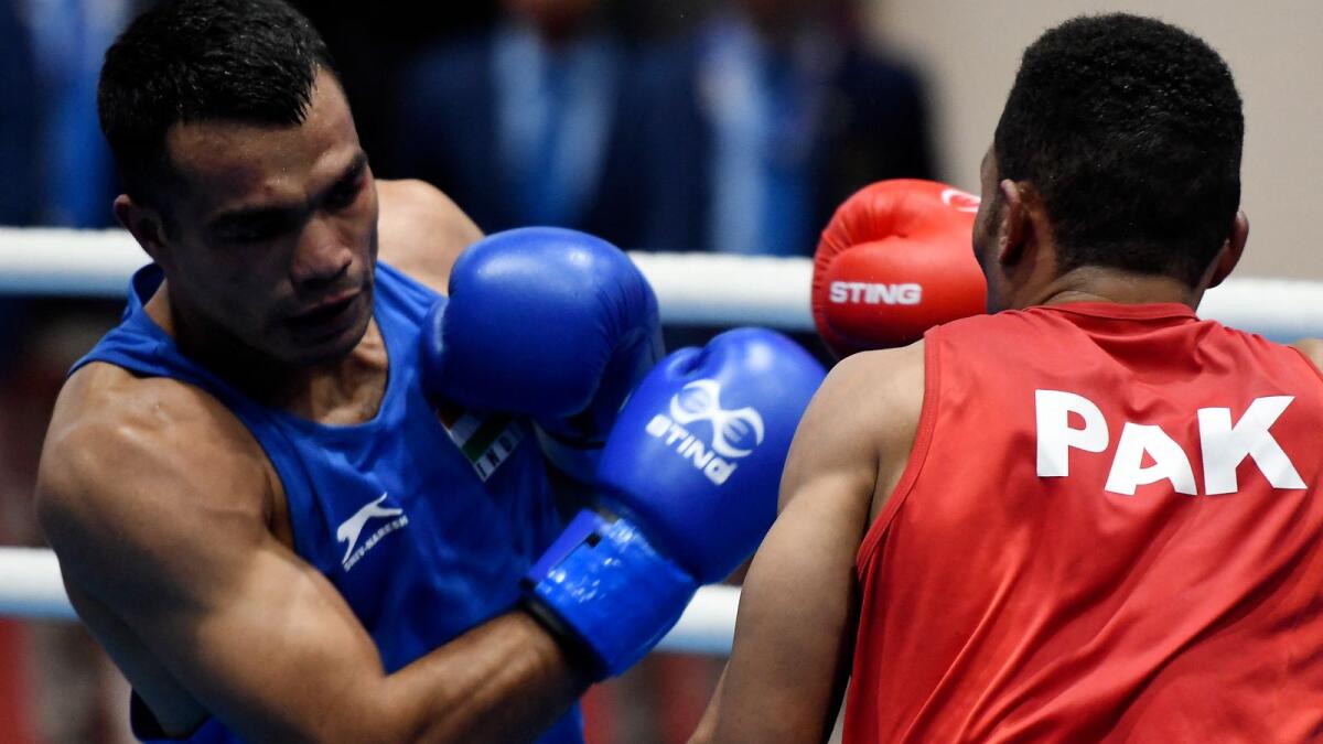 India's Vikas Krishna (left) fights against Pakistan's Zaib Gul at the 13th South Asian Games in Kathmandu on December 10, 2019. (AFP file)