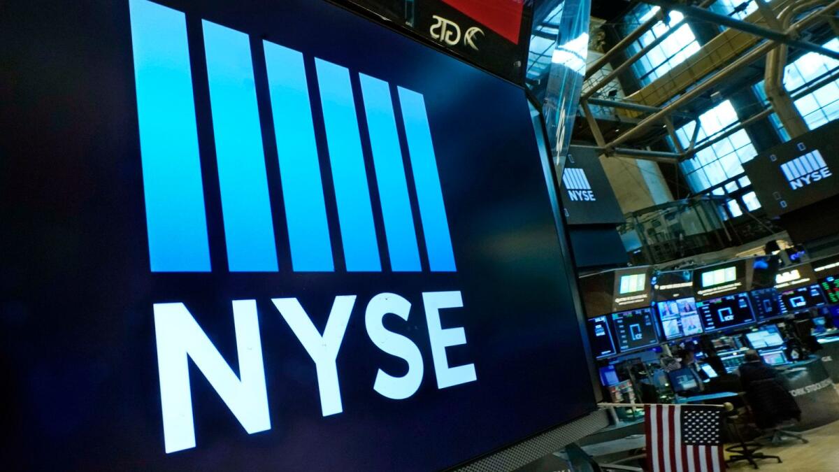 The New York Stock Exchange logo adorns a trading post on the floor of the Exchange. On Wall Street, stocks also advanced extending last week’s rally. — AP 