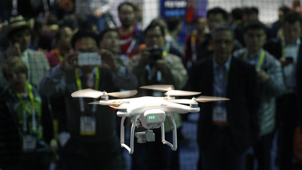 A drone hovers at the DJI booth during CES in Las Vegas. — AP
