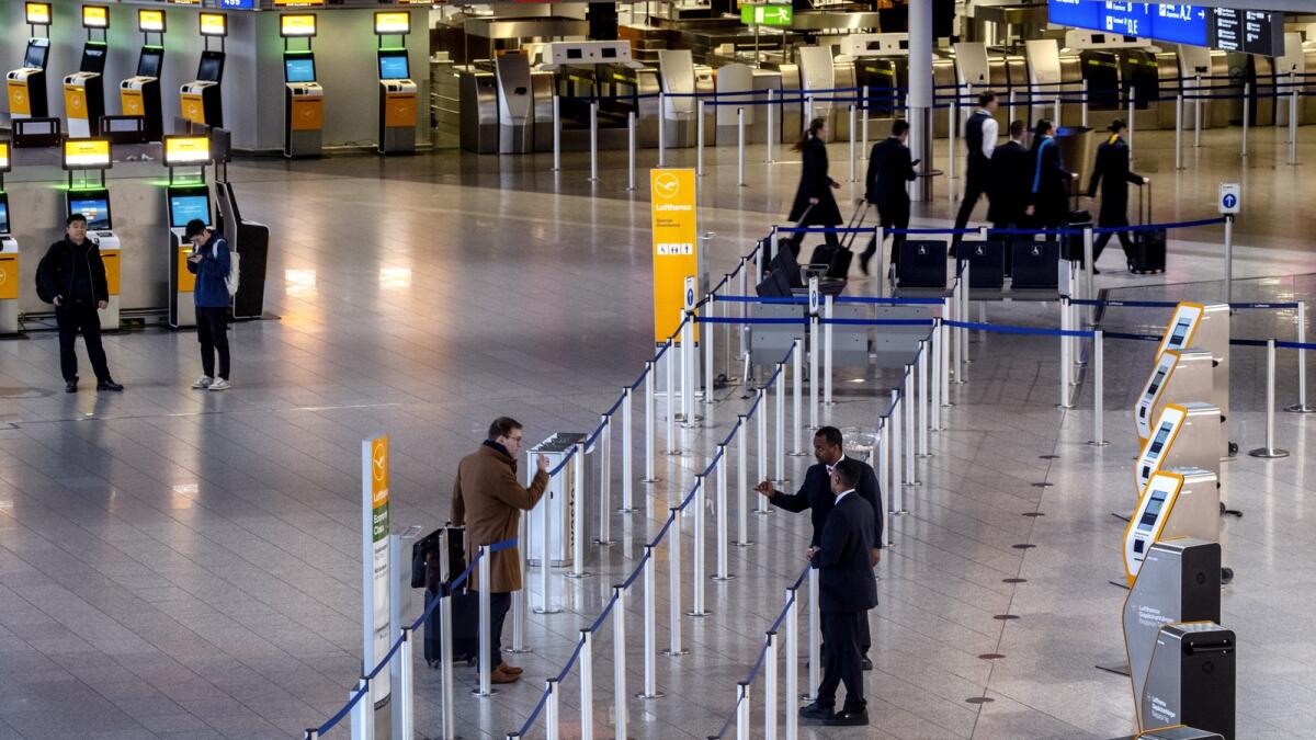A nearly empty terminal at the airport in Frankfurt, Germany, on March 7 as airport staff went on strike. — Photo: AP