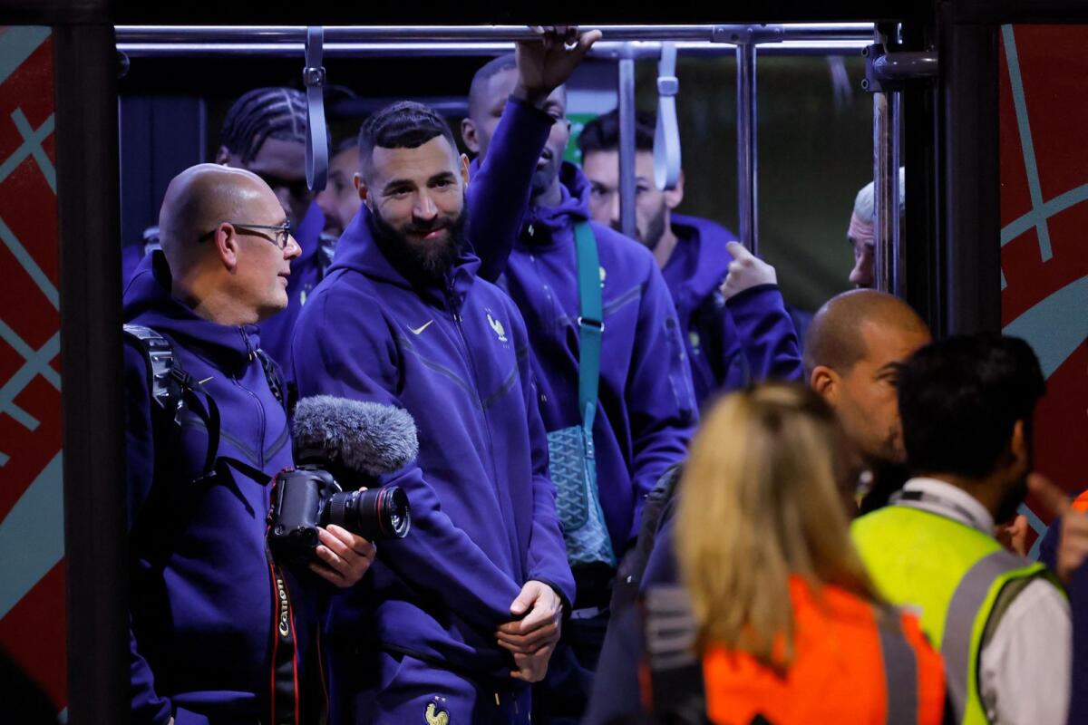 France forward Karim Benzema (centre) with the team at the Hamad International Airport in Doha on Wednesday. — AFP