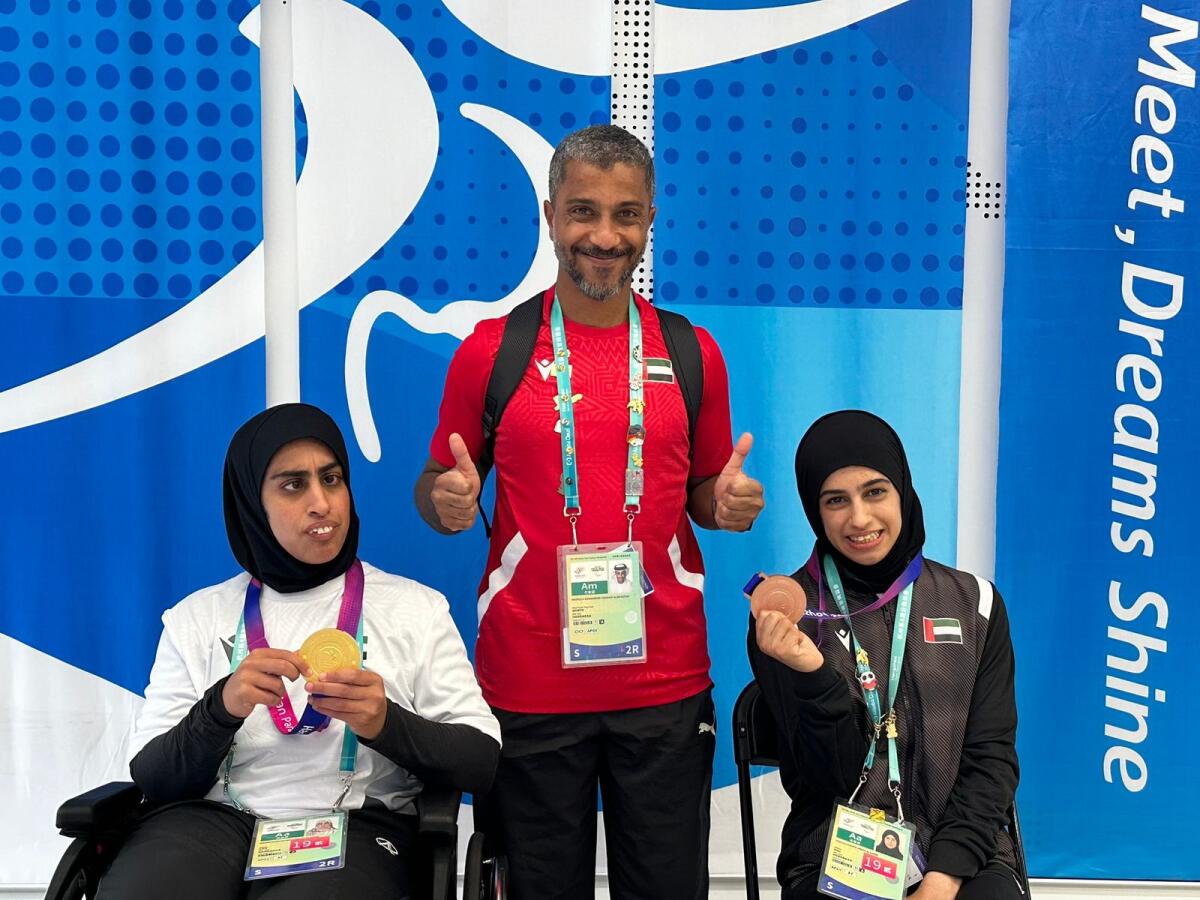 Dr Abdulla Mohammad Alrahoomi with the UAE's athletes of determination. Photos: Supplied