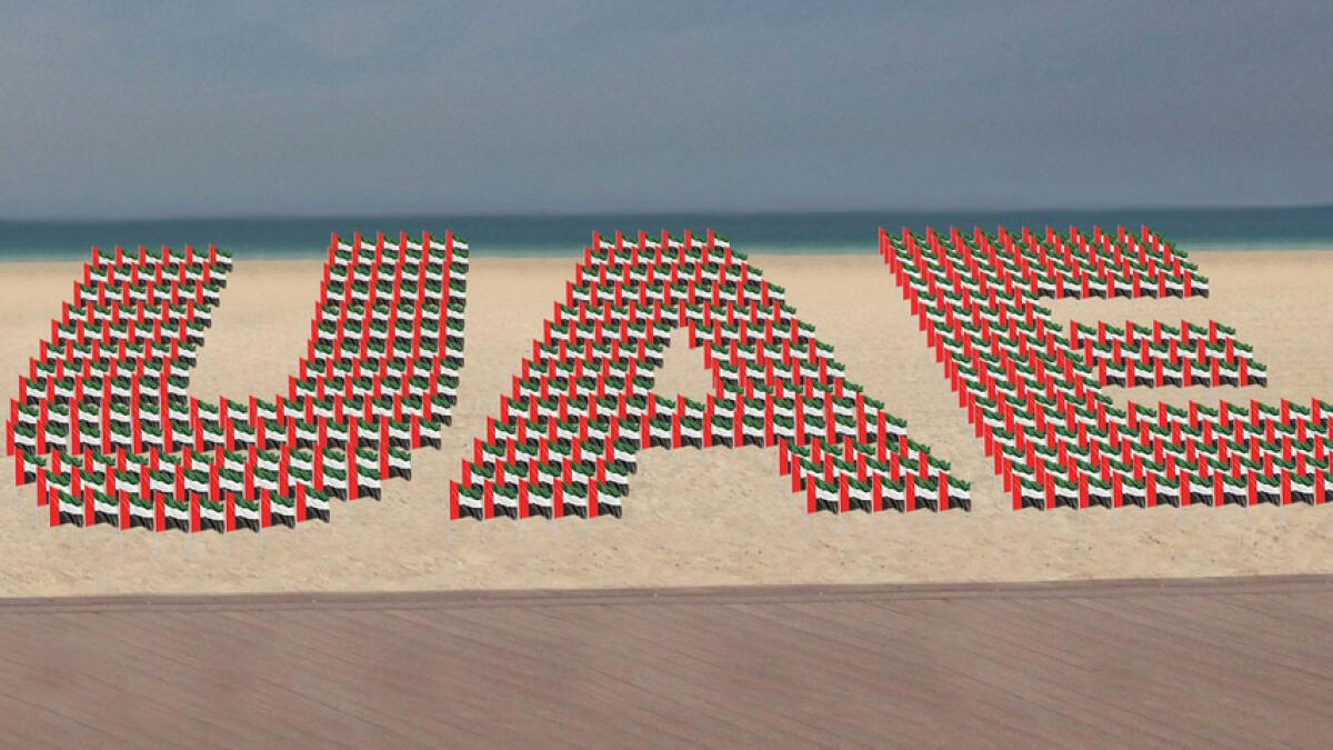 Thousands of flags will be arranged to create the letters 'UAE' at the Kite Beach in Jumeirah, Dubai, today.