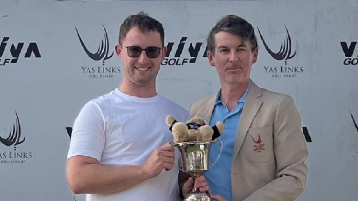Champion Padraig Curry (left) with Yas Links Club Captain Damien Ward at the prize presentation of the Yas Links Abu Dhabi Men's Open.- Supplied photo