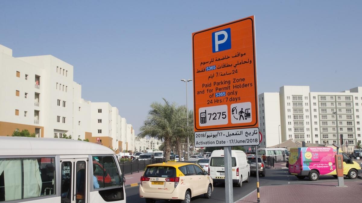 RTA parking board at the Al Khail Heights community displays the 24 hours, 7 days a week parking fee information which will come in effect from 17th June.-Photo by Neeraj Murali/Khaleej Times