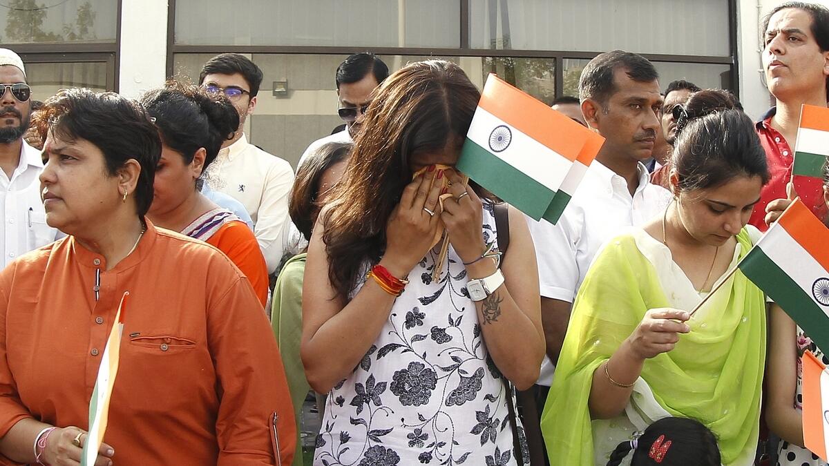 Indian expats overcome with emotion as they listen and sing patriotic songs on the 73rd Independence Day at the Indian Consulate in Dubai.  Photo by Juidin Bernarrd/Khaleej Times