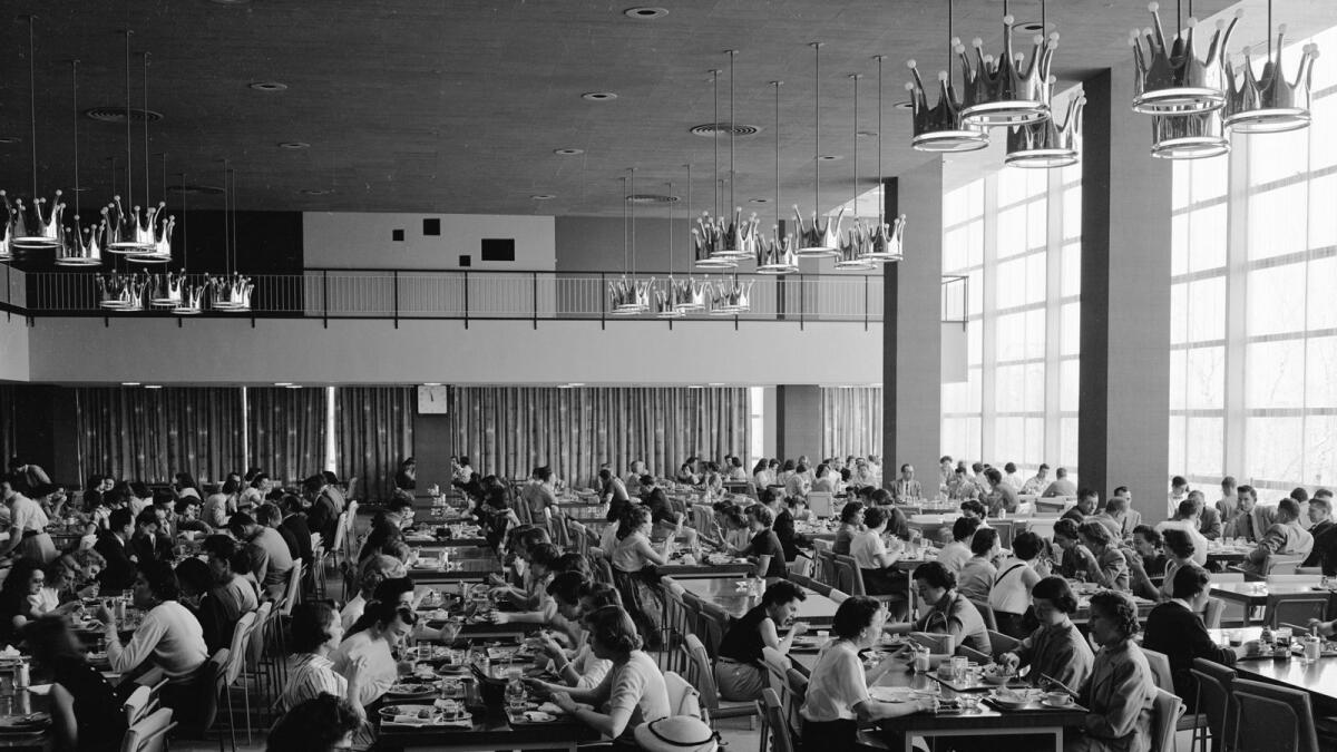 A photo provided by Hallmark shows employees dining in the corporate cafeteria at company headquarters in Kansas City, Mo., in 1956. Hallmark helped set the template for the huge corporate cafeteria with its Crown Room, which opened in 1956. (Hallmark via The New York Times)