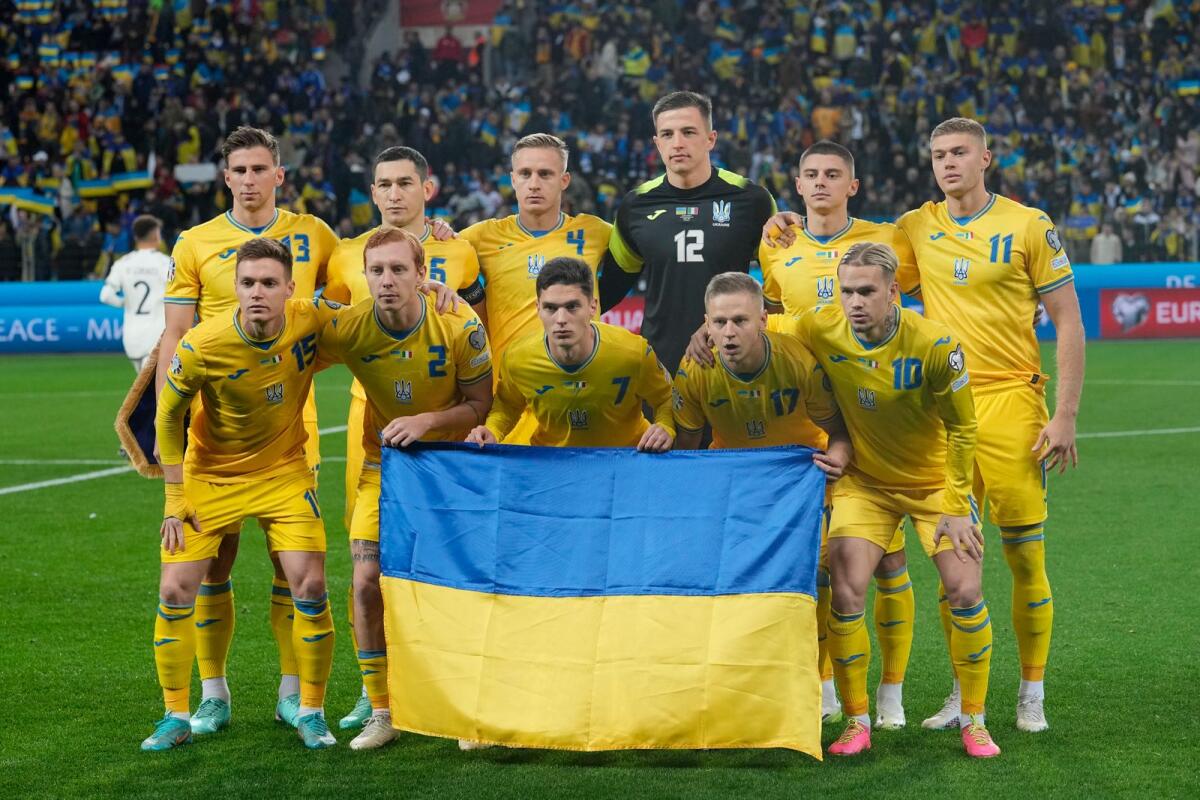 Ukraine squad pose before the match against Italy in Leverkusen on Monday. — AP