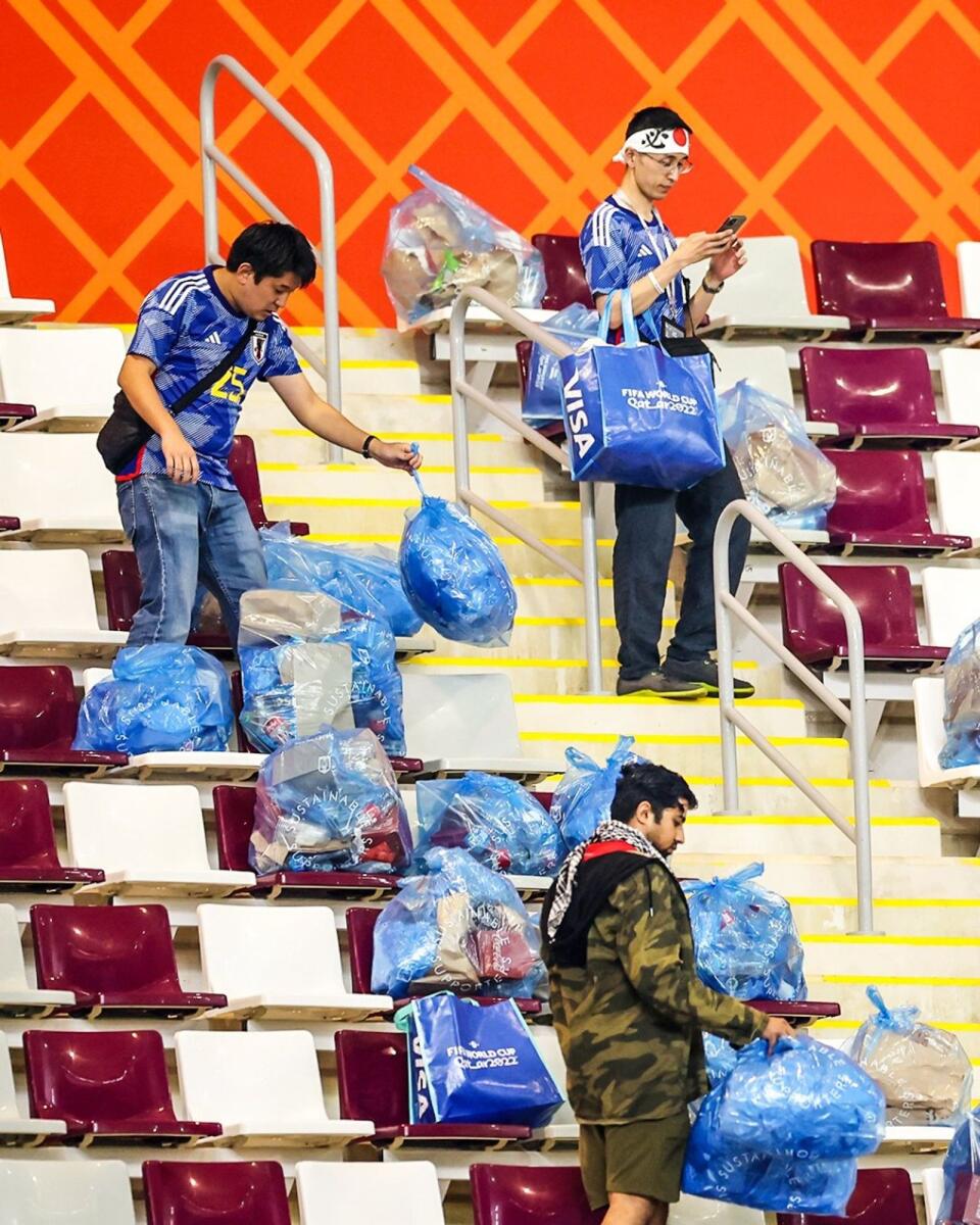 Japanese fans charmed the world with their act of cleanliness when they cleared the litter at the Khalifa International Stadium following their team's victory over Germany. Photo: Twitter
