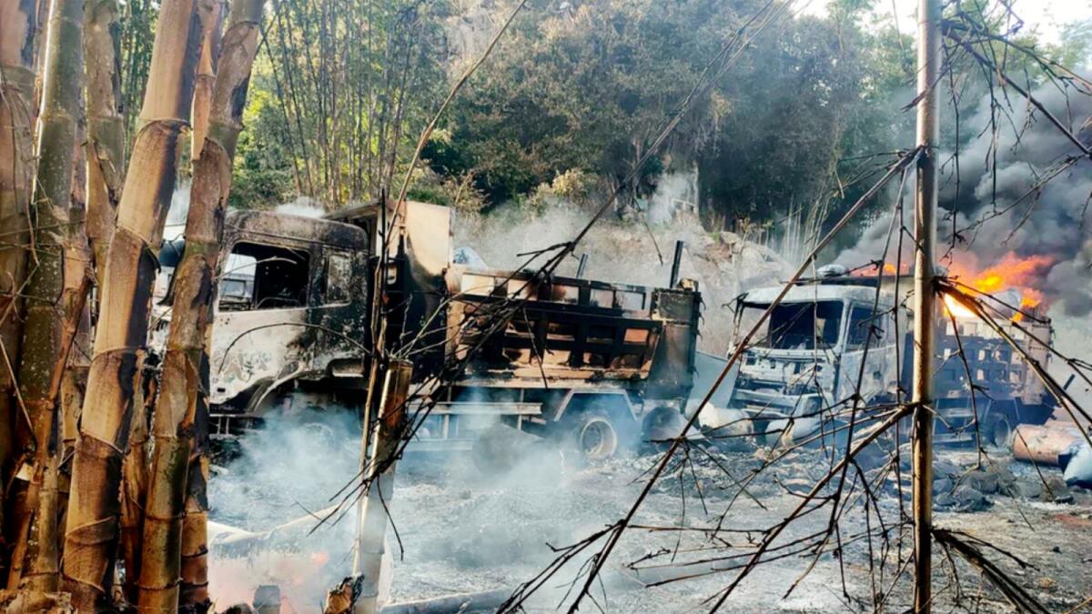 In this photo provided by the Karenni Nationalities Defense Force (KNDF), smokes and flames billow from vehicles in Hpruso township, Kayah state, Myanmar. — AP