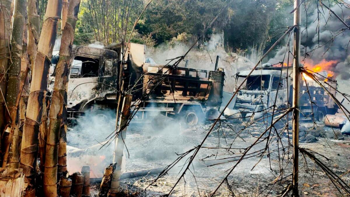 In this photo provided by the Karenni Nationalities Defense Force (KNDF), smokes and flames billow from vehicles in Hpruso township, Kayah state, Myanmar. — AP