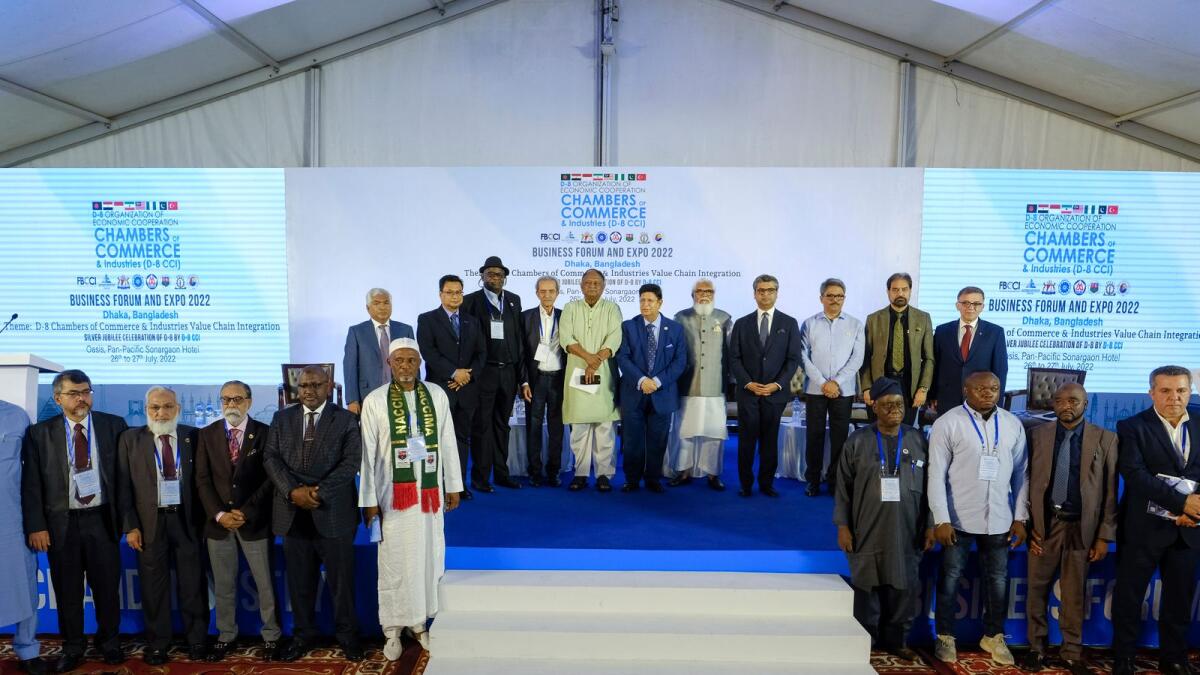 Business leaders and officials from eight developing nations stand for a photograph during the D-8 Chambers of Commerce and Industry Business Forum in Dhaka on July 26, 2022. — AP
