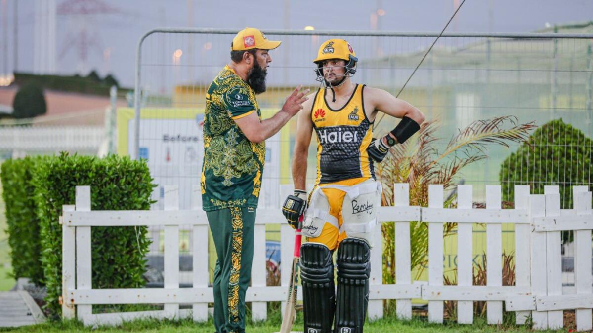 Pakistan former captain Inzamamul Haq is giving some tips Haider Ali during the Peshawar Zalmi practice session in Abu Dhabi. — Twitter